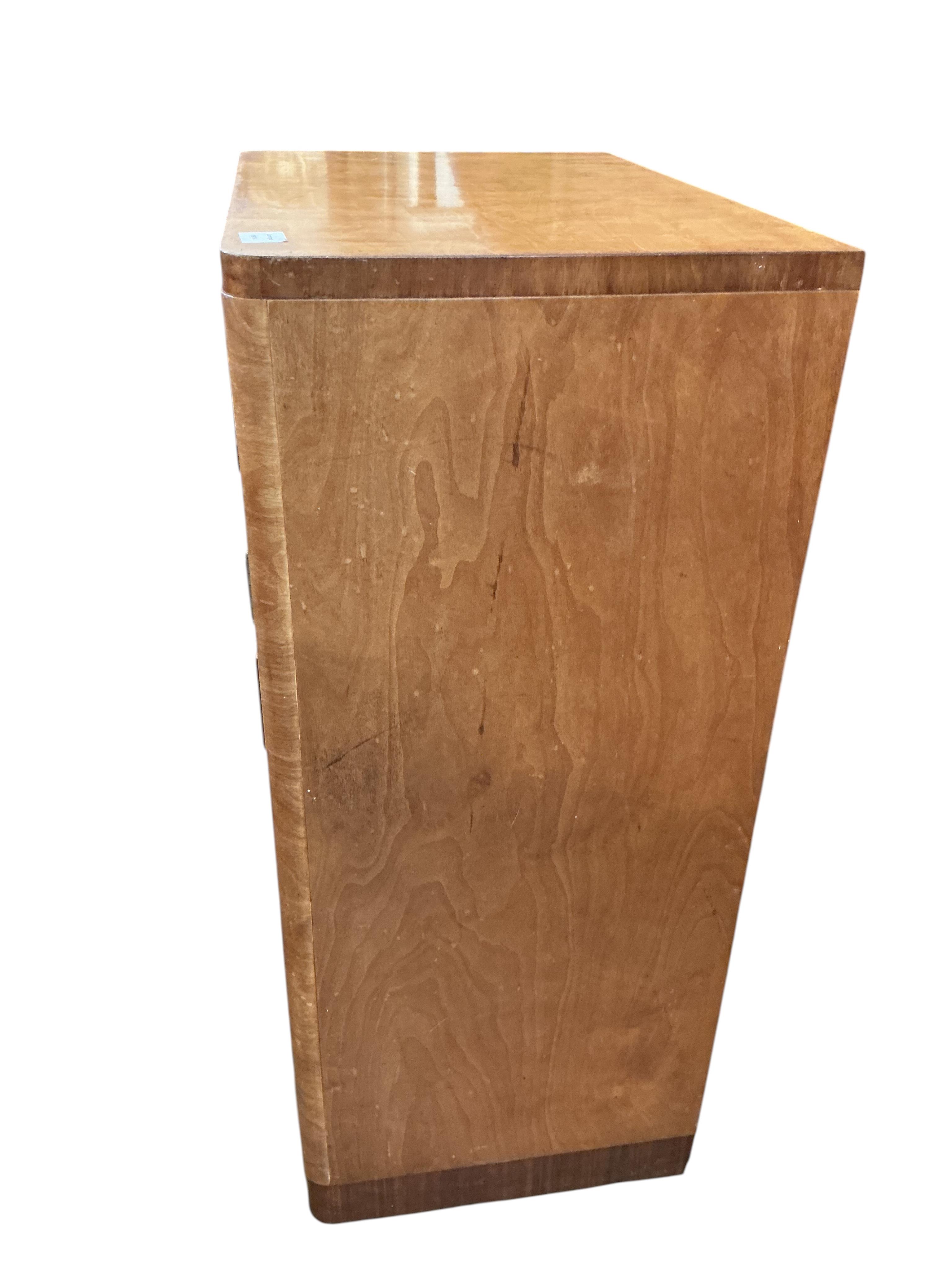 An early 20th century maple two drawer press cupboard, width 68cm, depth 45cm, height 107cm